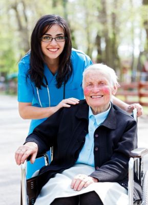 Client in a wheelchair with her caregiver